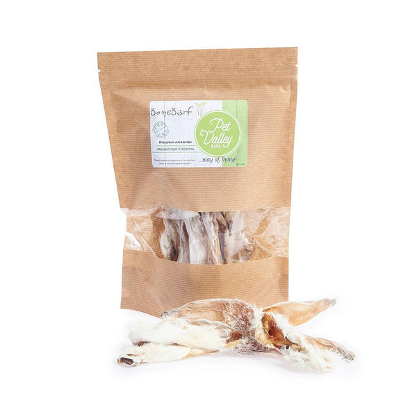 BoneBarf rabbit ears with fur in a biodegradable bag, a natural treat for dogs.