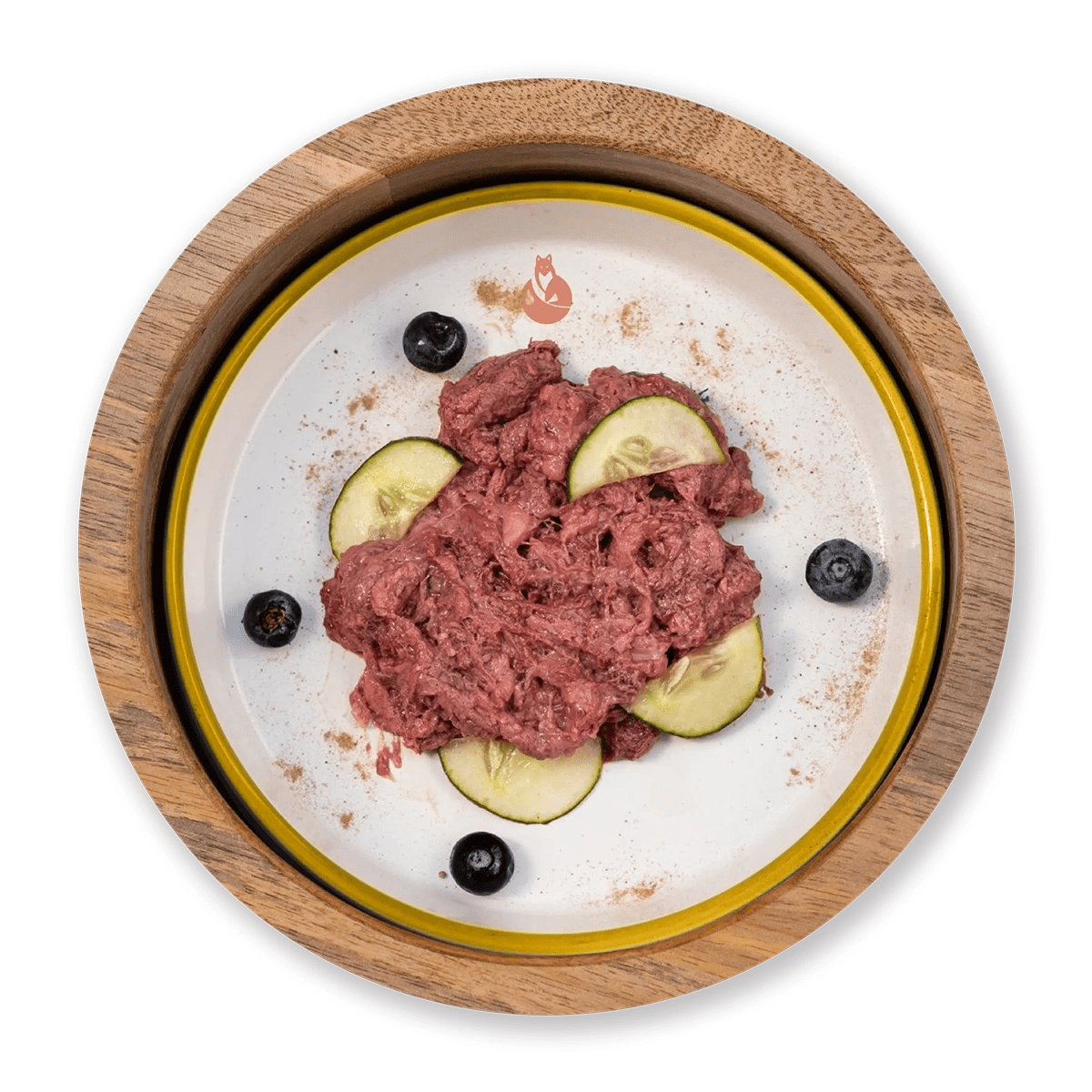 Dottor Fox BARF turkey meat served in a wooden bowl with cucumber slices and blueberries.