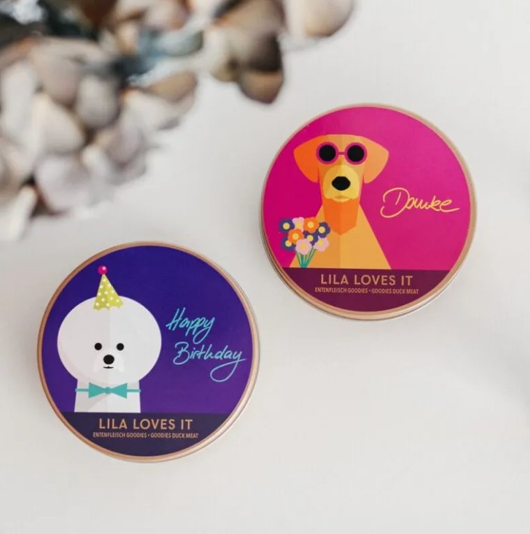 Colorful gift tins from LILA LOVES IT featuring a birthday design and dog, perfect for celebrating special occasions.