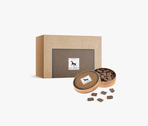 Lila Loves It goat meat treats in a round tin and box, perfect for training dogs and sensitive stomachs.